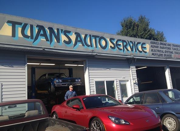 Shop Exterior with Red Sports Car